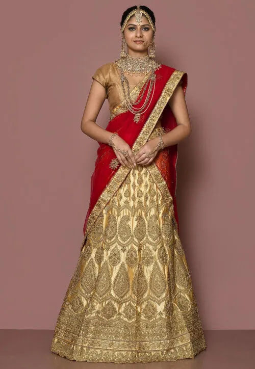 Peach-coloured and golden lehenga choli with dupatta this piese are art  silk blouse and next fabric lehenga choli available at | wholesale textile