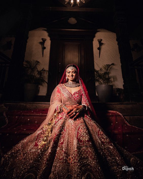 A Gorgeously Intimate Udaipur Wedding And A Bride In Traditional Red | Bridal  lehenga collection, Bridal lehenga red, Indian bride outfits
