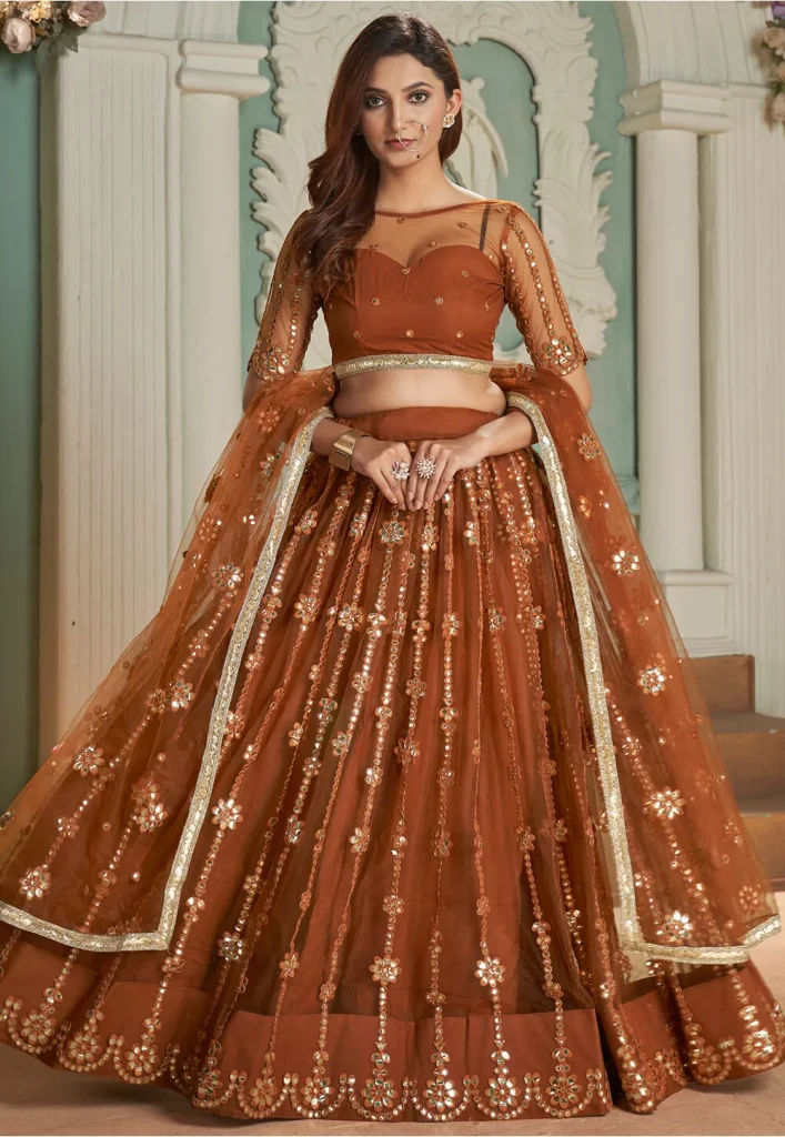 Embroidered Net Lehenga in Rust