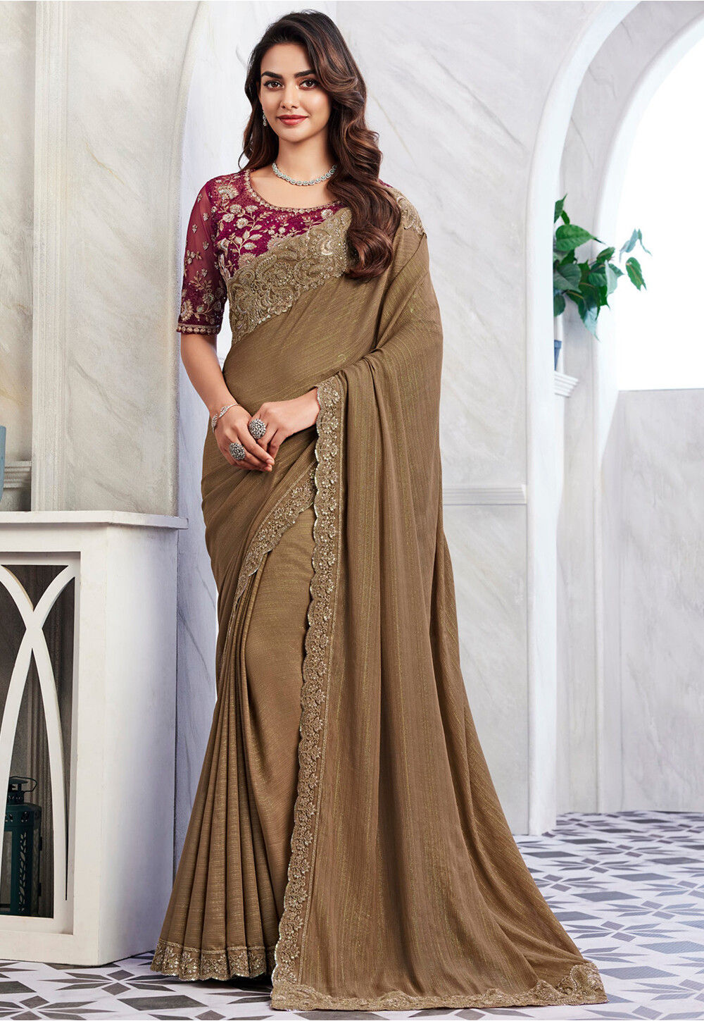 Solid saree with embellished scalloped border and zari-embroidered blouse.