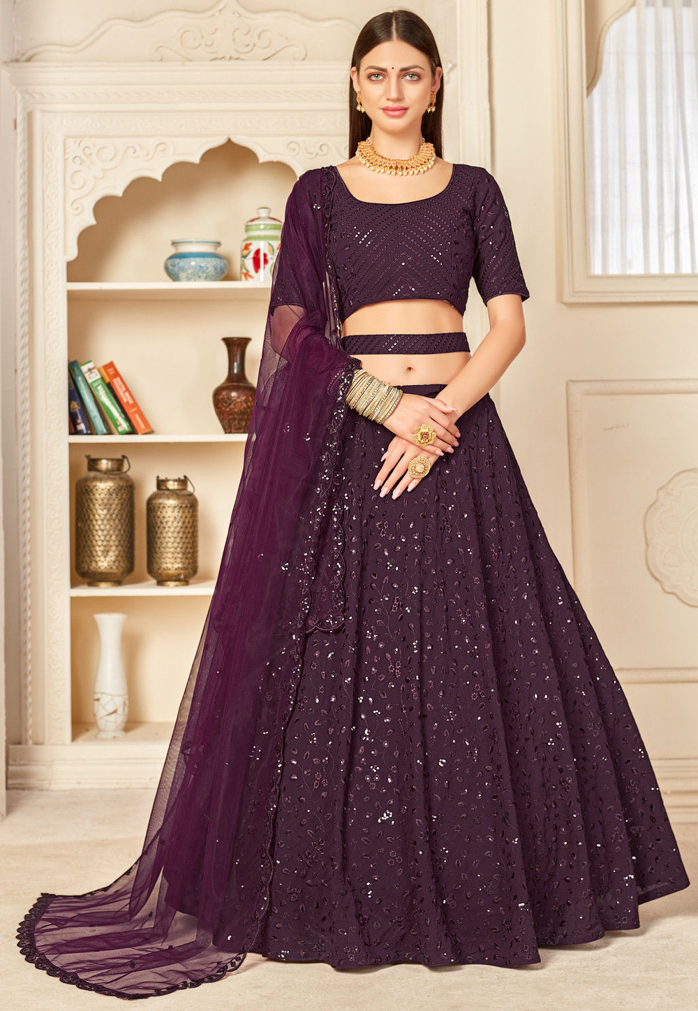 WINE MAGENTA LEHENGA SET WITH MULTI COLOURED THREADWORK AND “ABLA”  EMBROIDERY PAIRED WITH A SCALLOPED NECKLINE CLASSIC BLOUSE AND A MATCHING  DUPATTA WITH TASSELS AND SILVER EMBELLISHMENTS. - Seasons India