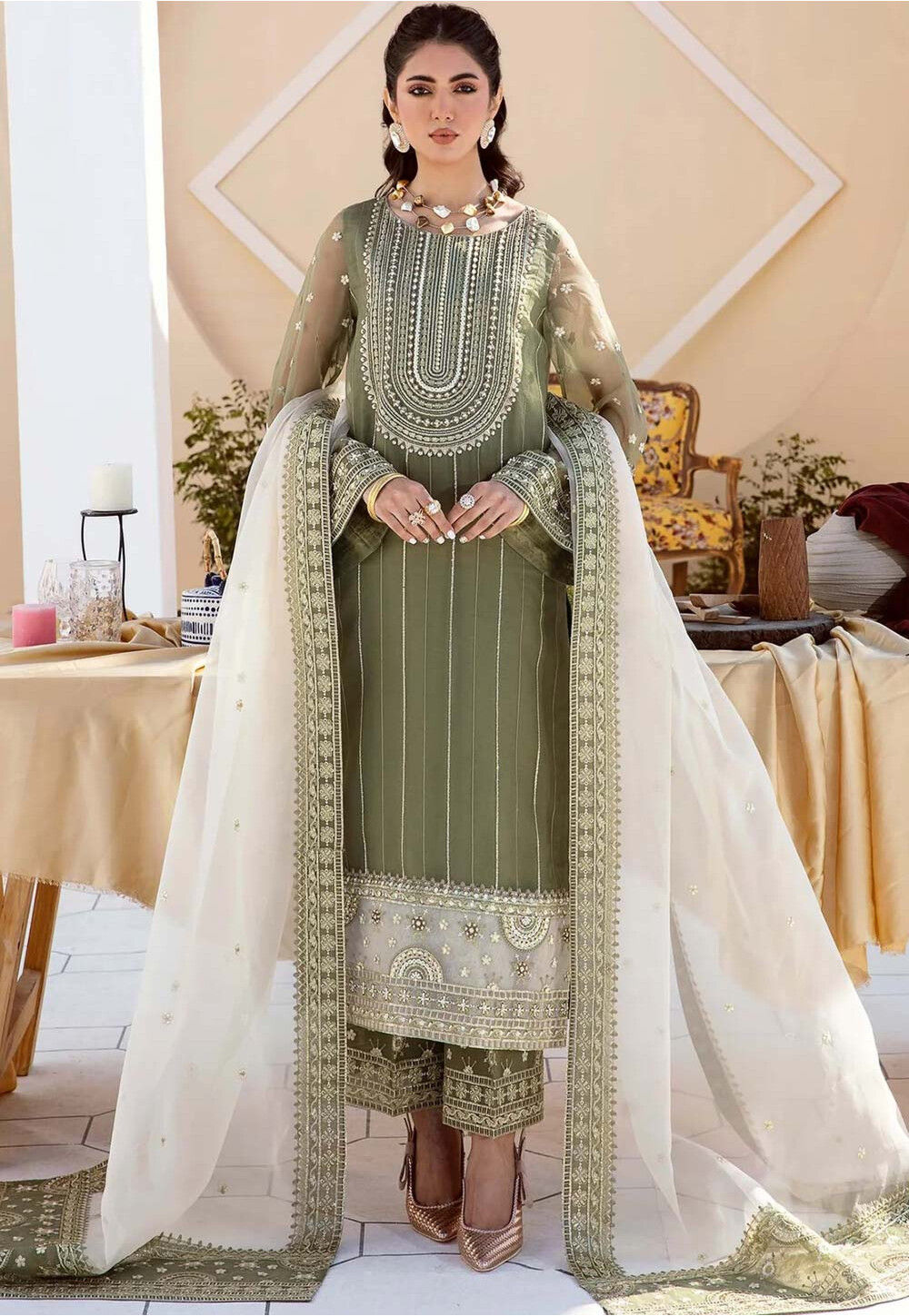 https://medias.utsavfashion.com/media/catalog/product/cache/1/image/1000x/040ec09b1e35df139433887a97daa66f/e/m/embroidered-organza-pakistani-suit-in-dusty-green-v1-kch12628.jpg