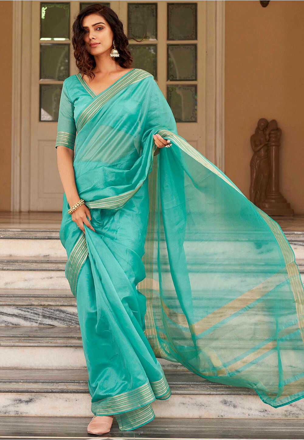 Powder blue and white half and half saree with dull gold filigree bord