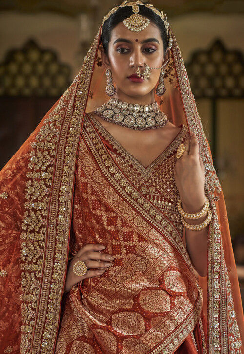 Embroidered Art Silk Lehenga in Rust