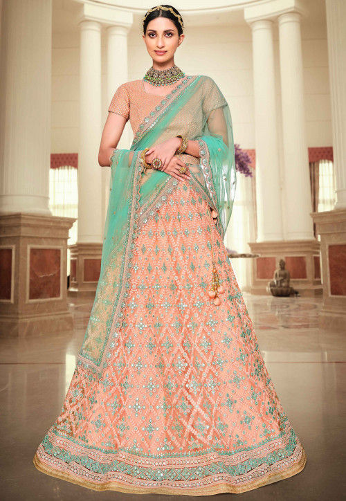 Bridal lehenga paired with pink color heavily embellished choli and net  heavy embroidered border in peach and maroon color. |lovelyweddingmall.com|