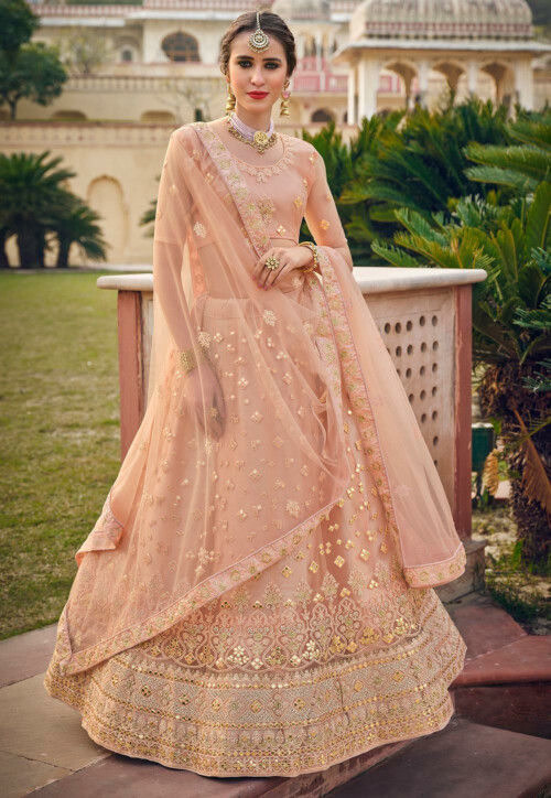 Photo of Beautiful Pink and gold bridal lehenga with light peach dupatta