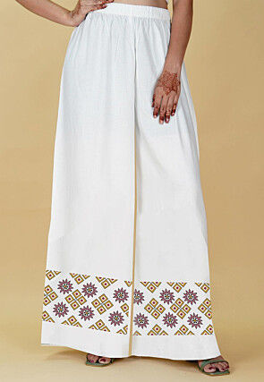 Off white palazzo pants online top