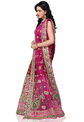 Embroidered Net Lehenga in Rust 