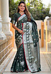 Woven Art Silk Saree in Dark Green